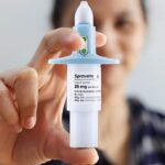 person holding nasal spray of spravato