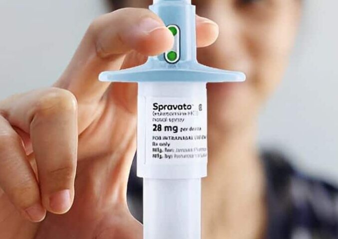 person holding nasal spray of spravato
